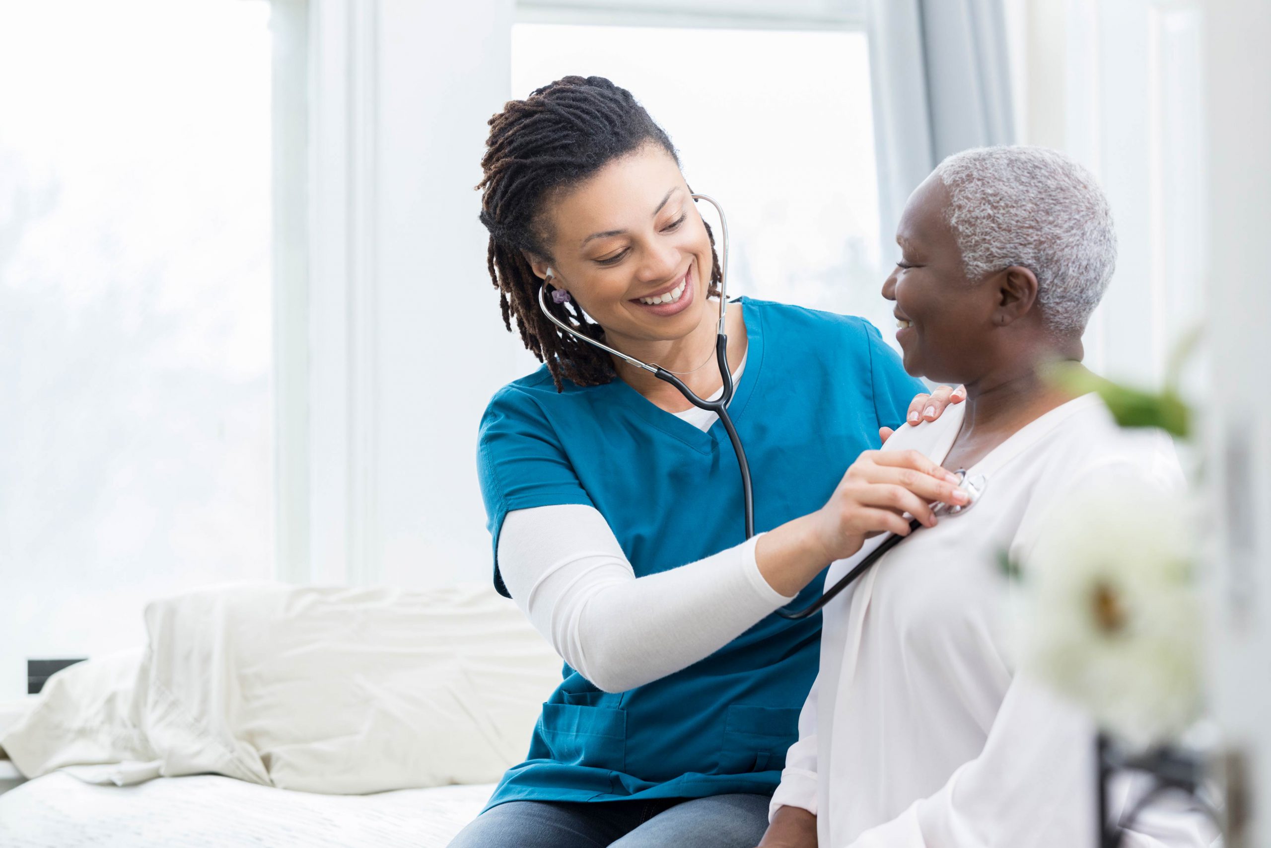 Healthcare professional attending to a patient